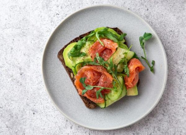 avocado toast with salmon on a plate