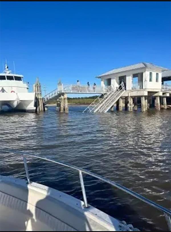 A boat next to collapsed dock