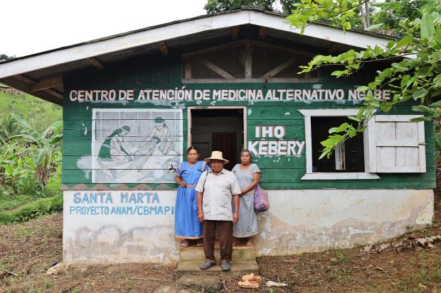 Santa Marta's three traditio<em></em>nal medicine doctors, Viviana Mo<em></em>ntero (left), Mauricio Martínez and Elicia Martínez, stand in front of the town health clinic Iho Kebery.