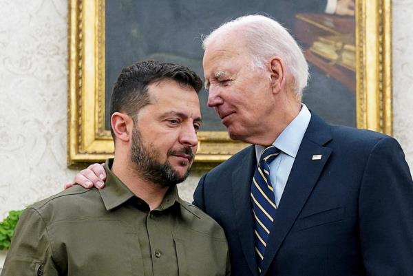 Ukrainian President Volodymyr Zelenskiy is embraced by U.S. President Joe Biden in the Oval Office of the White House in Washington, September 21, 2023. 