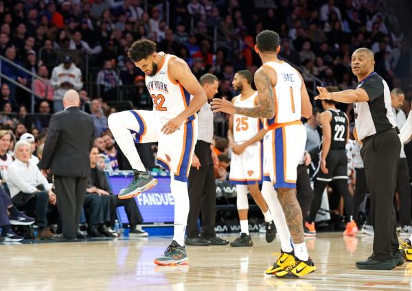 Karl-Anthony Towns #32 of the New York Knicks reacts after he falls over Noah Clowney.